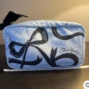 SkinMedica Light Blue Cosmetic Bag with Black Bow